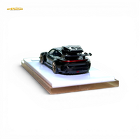 404ERROR Porsche Taycan Black with Roof Box 1:64