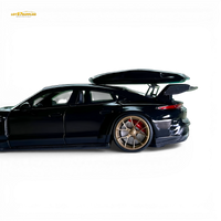 404ERROR Porsche Taycan Black with Roof Box 1:64