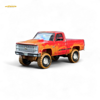 Auto World 1983 Chevrolet Silverado K10 4x4 Muddy Lifted 1:64