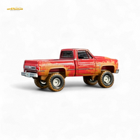 Auto World 1983 Chevrolet Silverado K10 4x4 Muddy Lifted 1:64